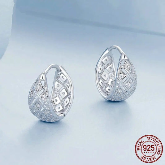 Genuine 925 sterling silver hollow lace hoop earrings.