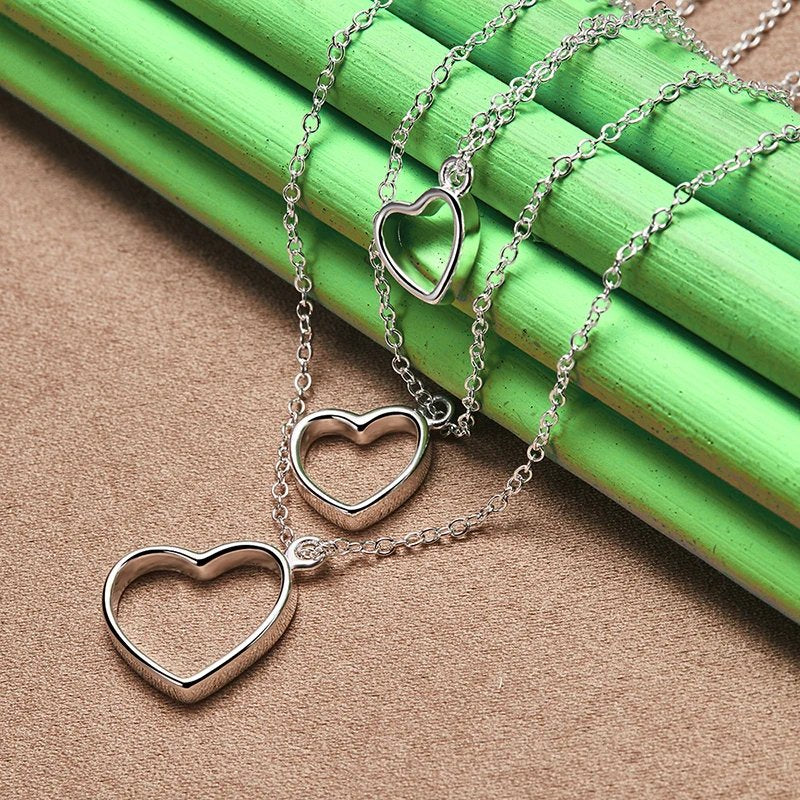 Pure 925 sterling silver three heart pendant necklace.