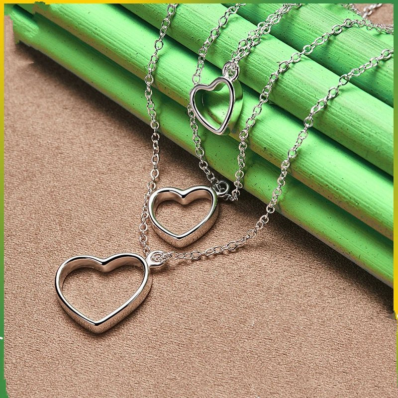 Pure 925 sterling silver three heart pendant necklace.