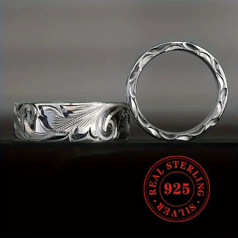 Wedding ring with engraved flower leaf motif.