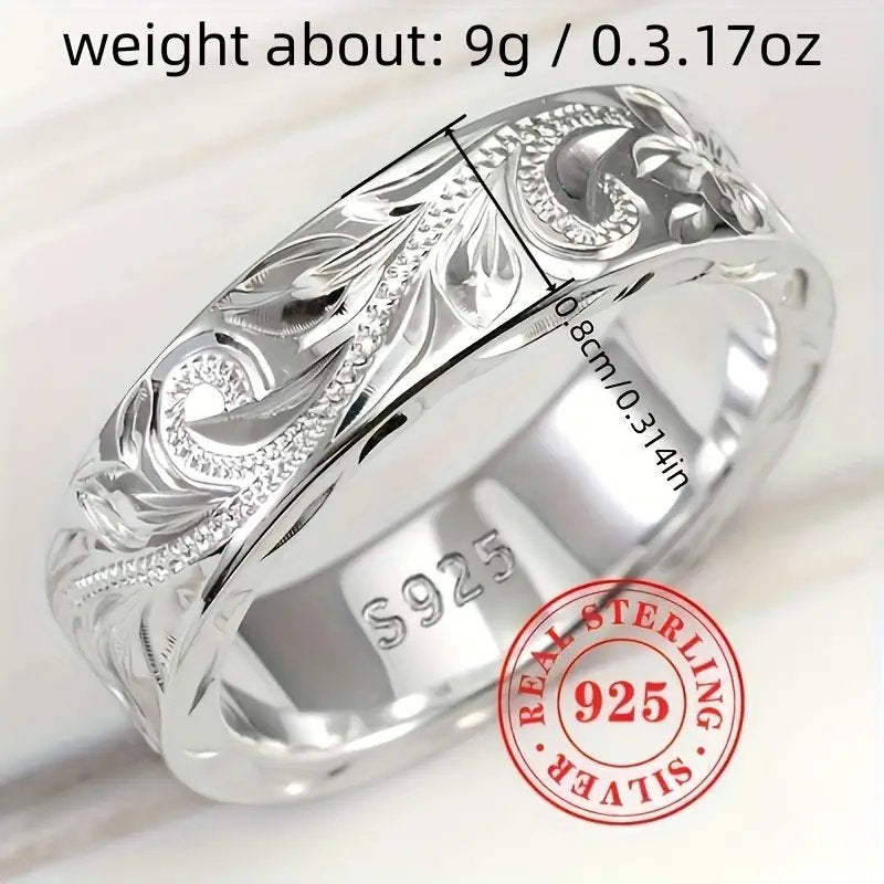 Wedding ring with engraved flower leaf motif.