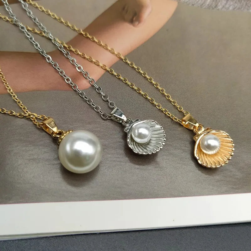 Imitation pearl shell pendant necklace.