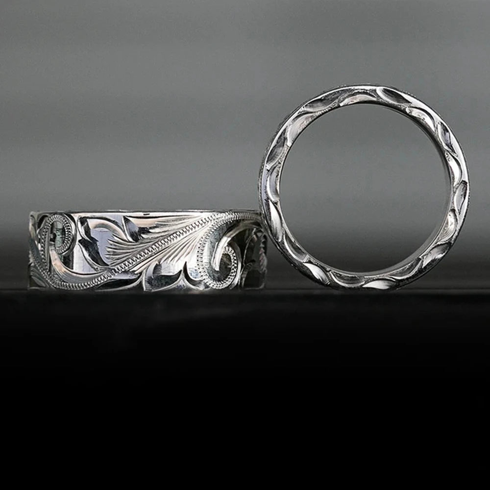 Wedding ring with engraved flower leaf motif.