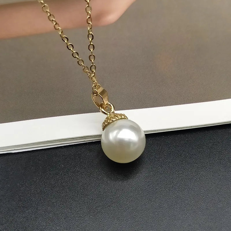 Imitation pearl shell pendant necklace.