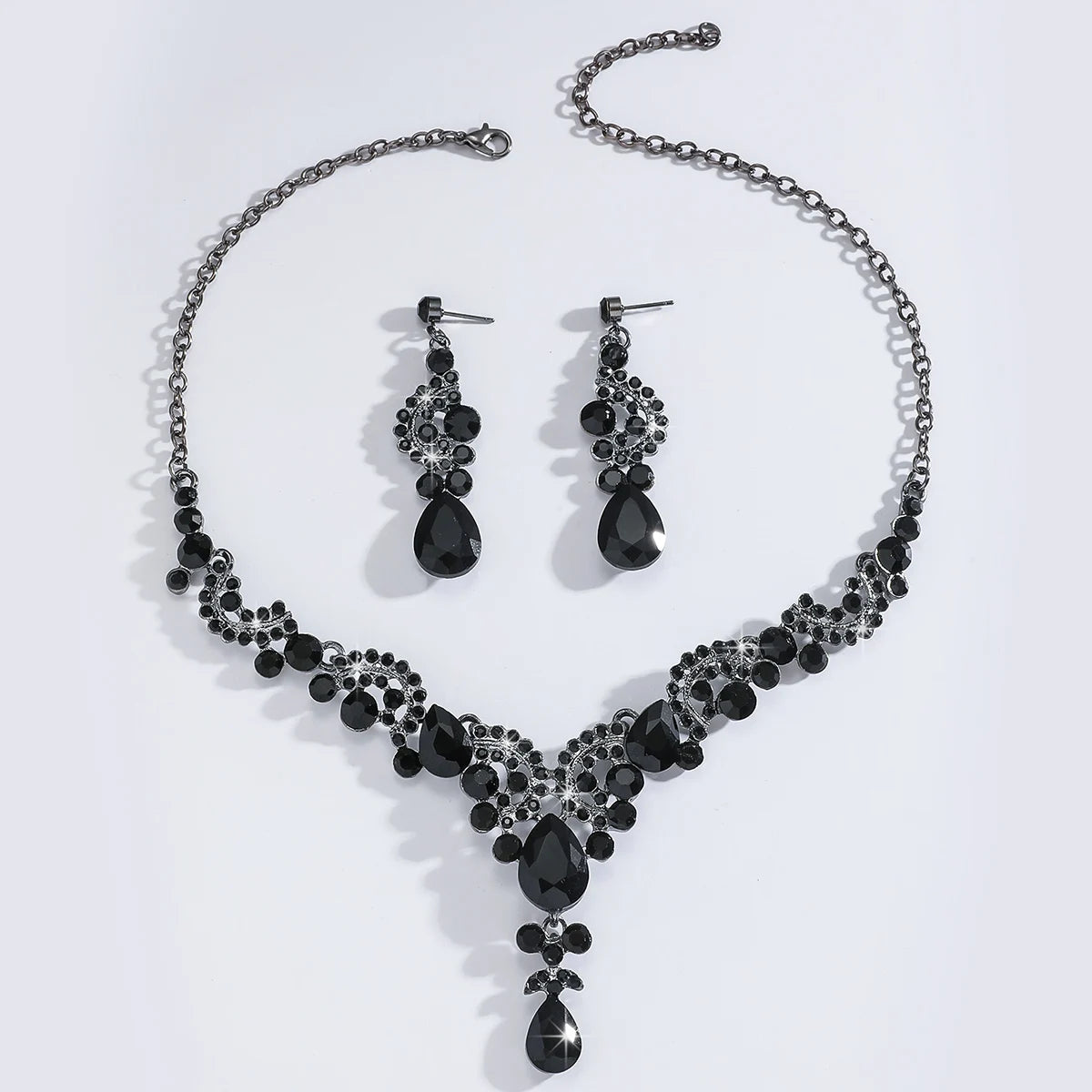 Trendy teardrop jewelry, 3 earrings with necklace.