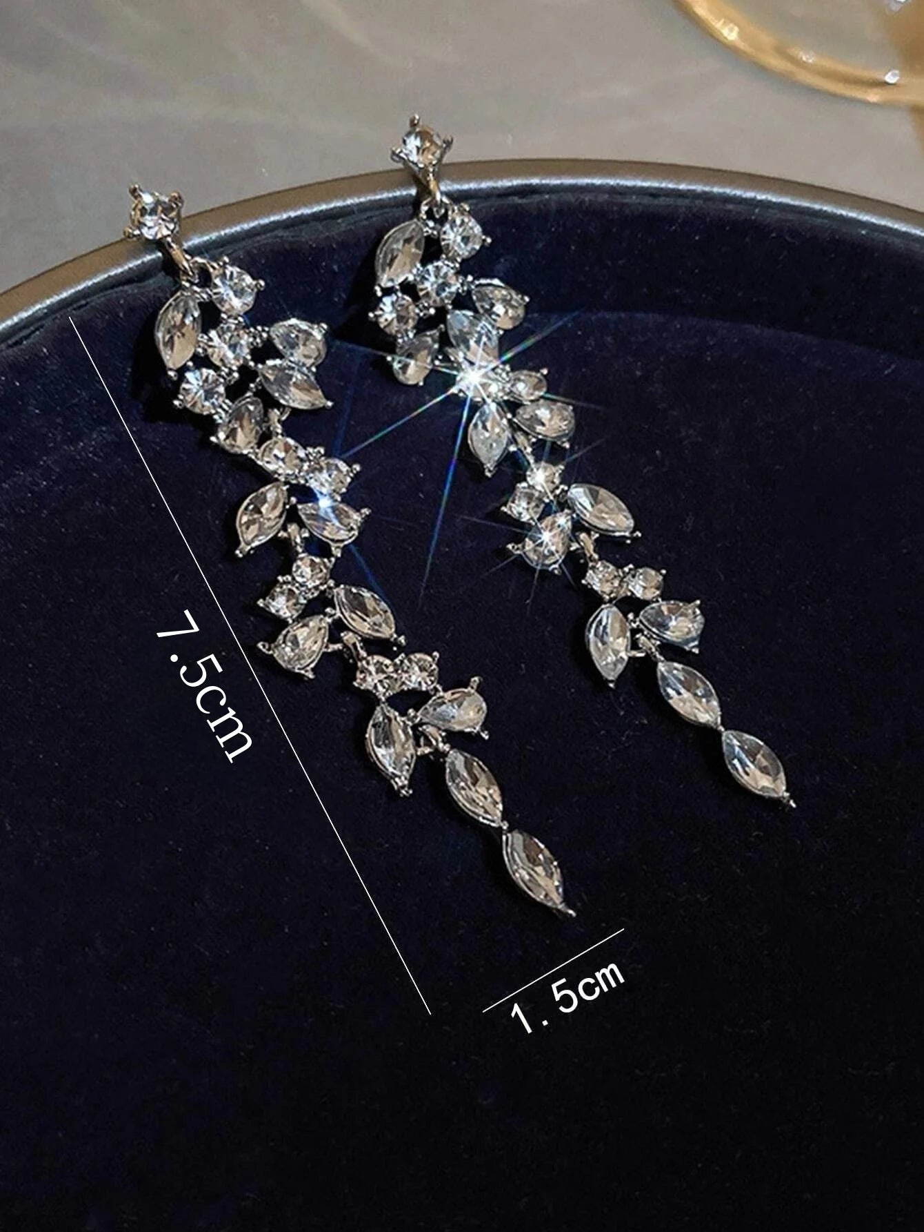 Long tassel earrings with diamonds.