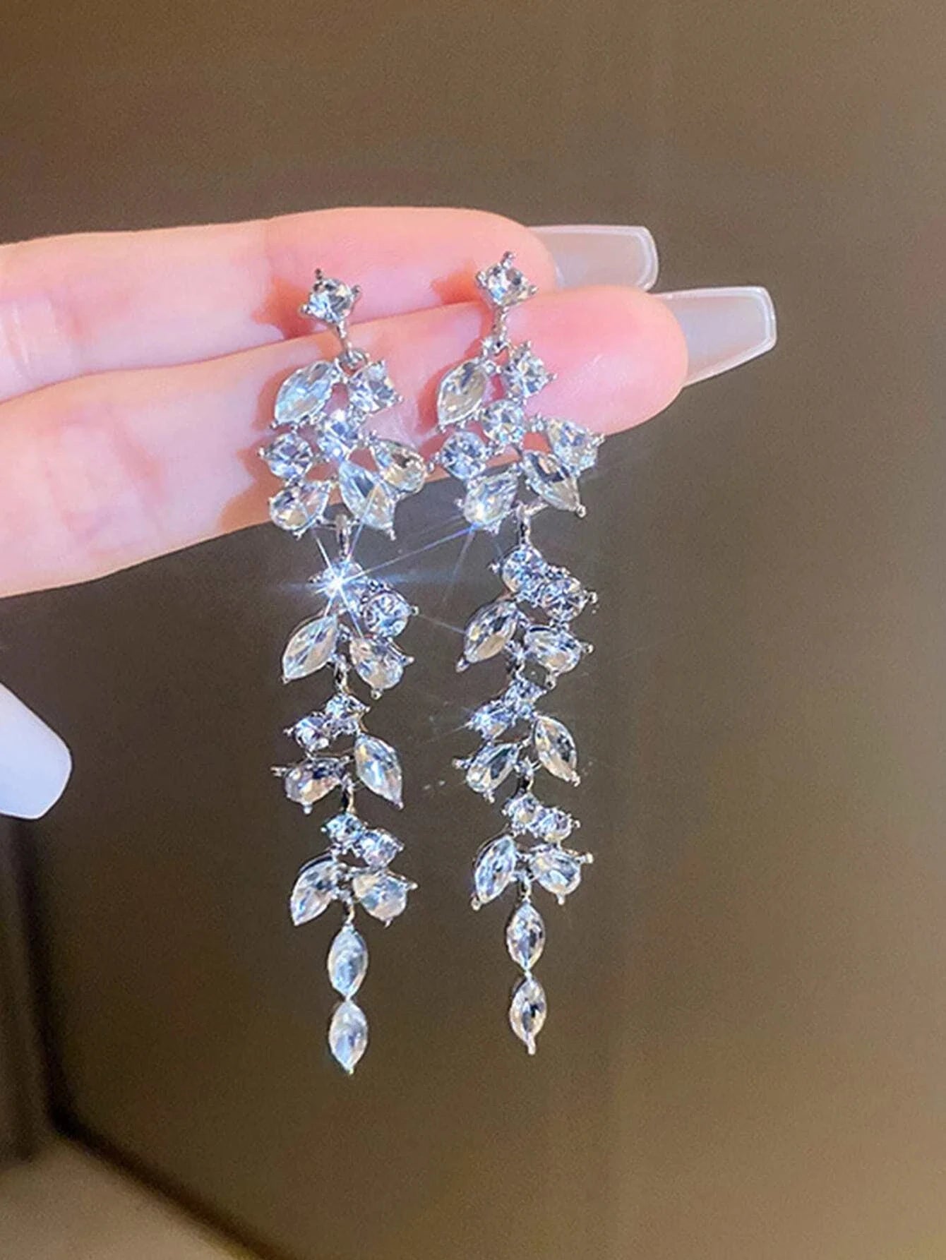 Long tassel earrings with diamonds.