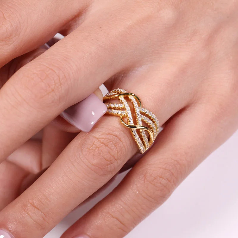 Gold colored multi-cross rings, luxury zirconia stones, elegant jewelry.