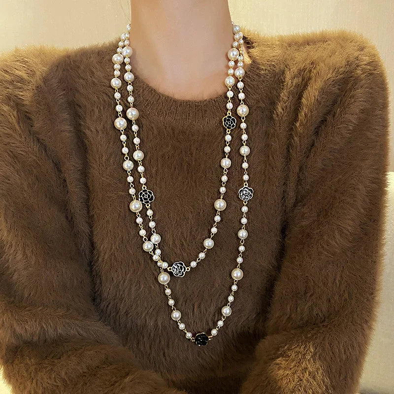 Necklace of long scented pearls.