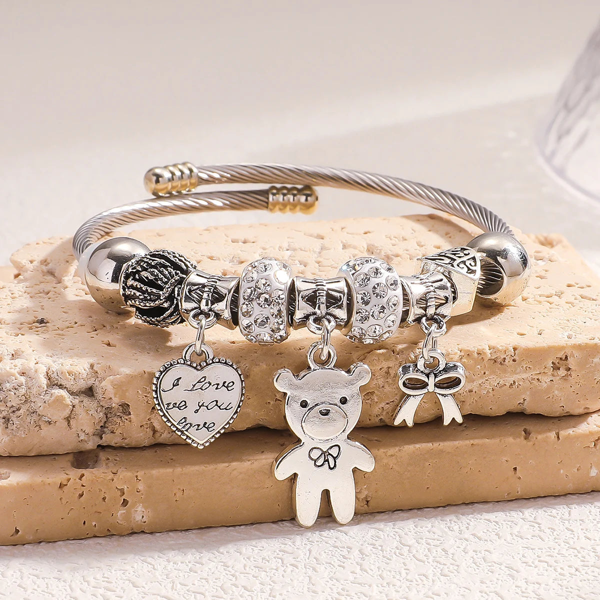 Bracelet with pearls and bear-shaped bow.