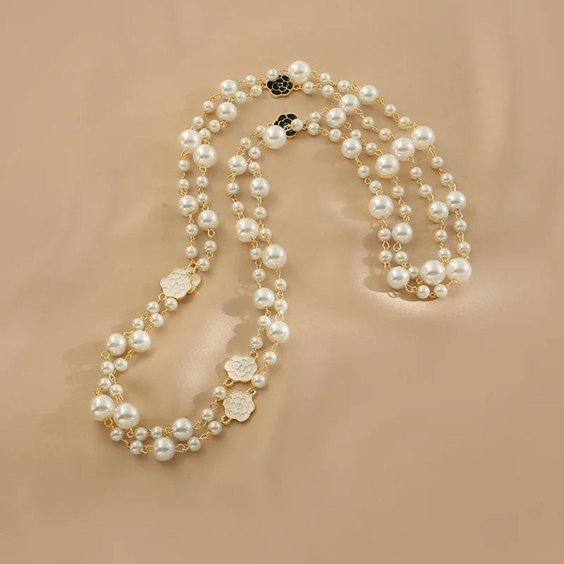 Necklace of long scented pearls.